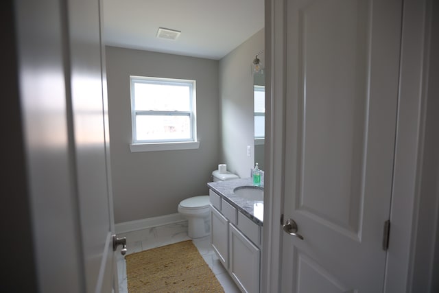 bathroom with vanity and toilet