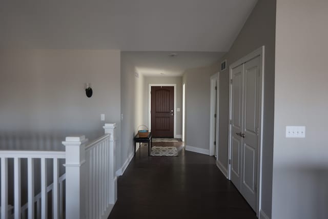 corridor featuring dark wood-type flooring