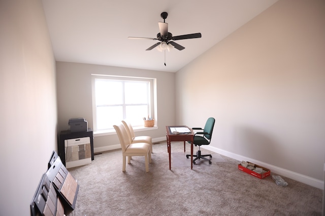 carpeted home office featuring ceiling fan and lofted ceiling