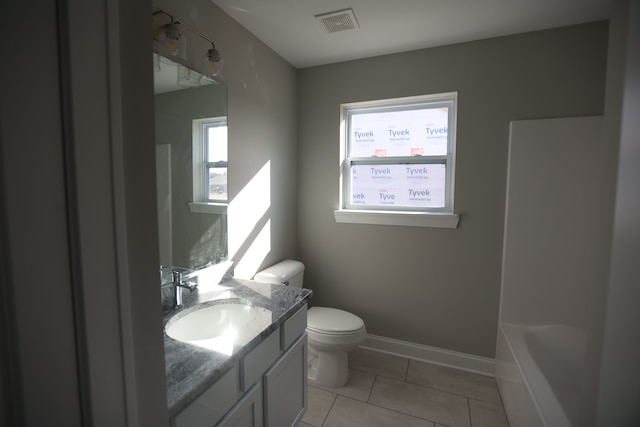 1012 Camellia Cir Unit 48, Howell, MI 48843 - full bathroom with toilet, vanity, tile patterned floors, a tub, and baseboards