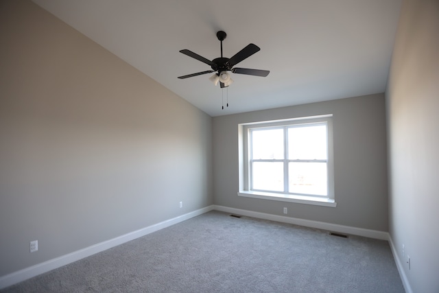 1012 Camellia Cir Unit 48, Howell, MI 48843 - unfurnished room featuring baseboards, light carpet, a ceiling fan, and vaulted ceiling