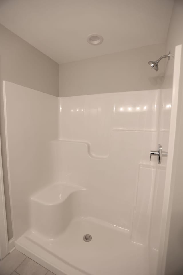 1012 Camellia Cir Unit 48, Howell, MI 48843 - bathroom featuring tile patterned floors and a shower