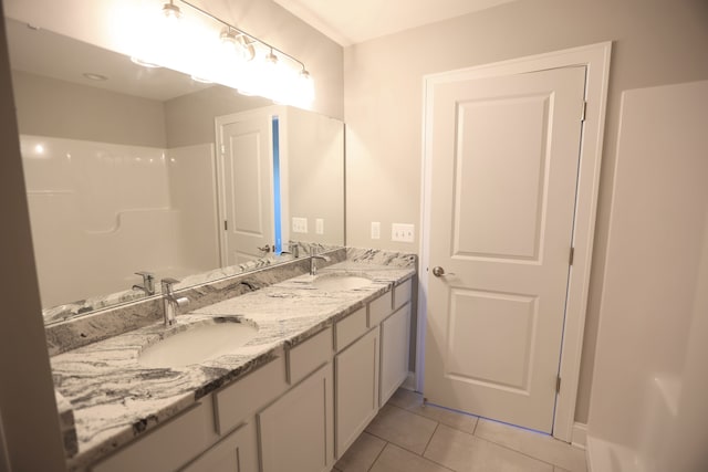 1012 Camellia Cir Unit 48, Howell, MI 48843 - full bathroom featuring tile patterned flooring, double vanity, and baseboards