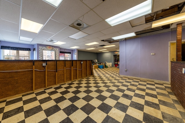 basement with a drop ceiling