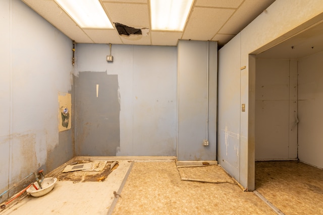 basement featuring a paneled ceiling