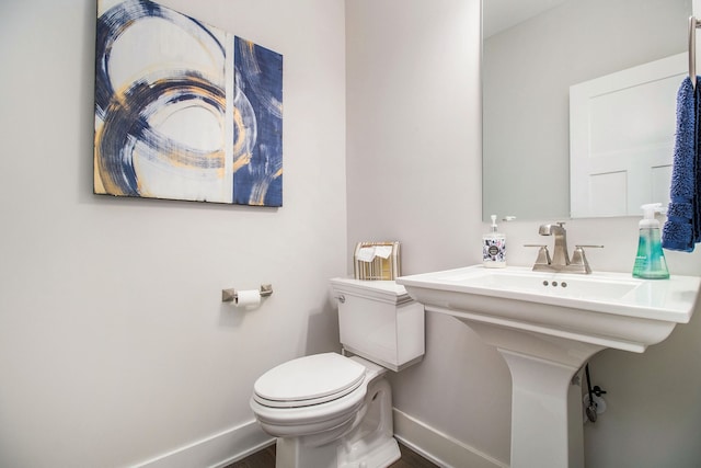 bathroom with toilet and sink