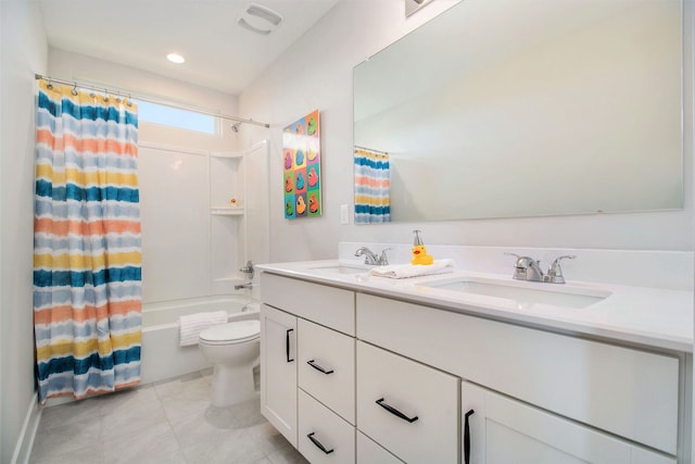 full bathroom with tile patterned floors, vanity, toilet, and shower / bath combo with shower curtain