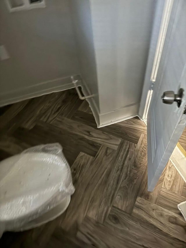 bathroom with parquet flooring