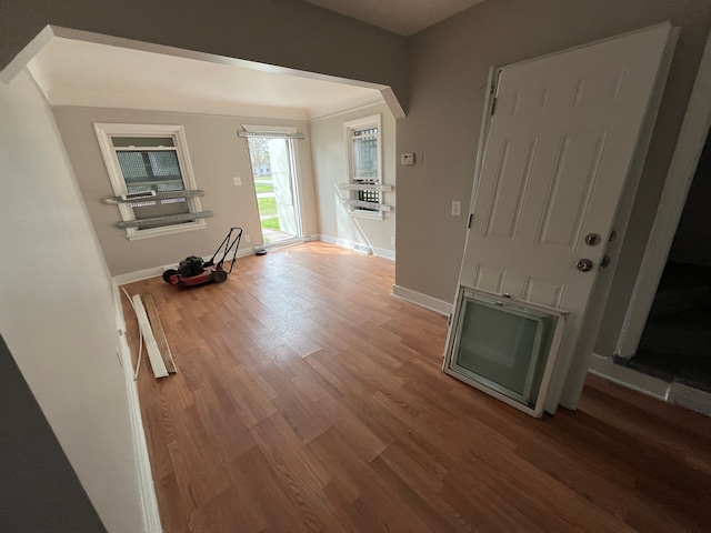 hall with hardwood / wood-style flooring