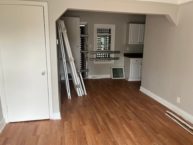 hall with hardwood / wood-style flooring