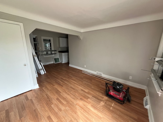 unfurnished living room with hardwood / wood-style flooring