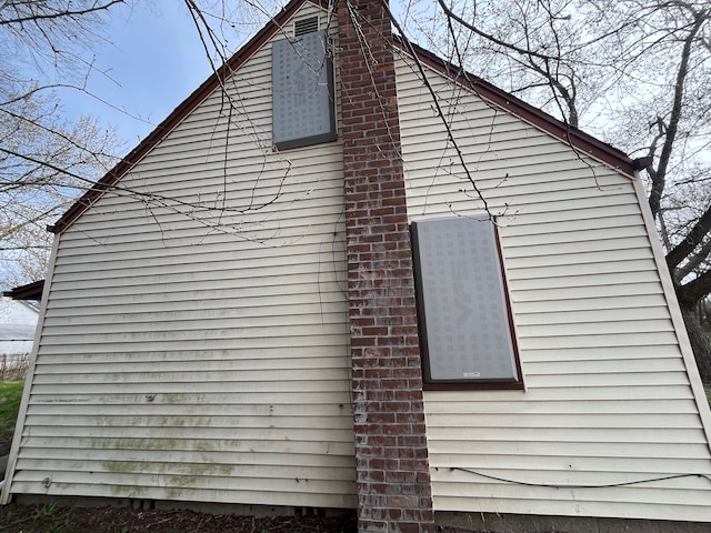 18109 Cornwall St, Detroit, MI 48224 - view of side of property featuring a chimney