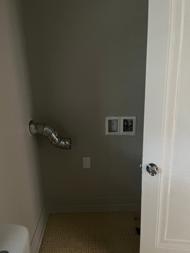 18109 Cornwall St, Detroit, MI 48224 - laundry area featuring washer hookup, baseboards, and tile patterned floors