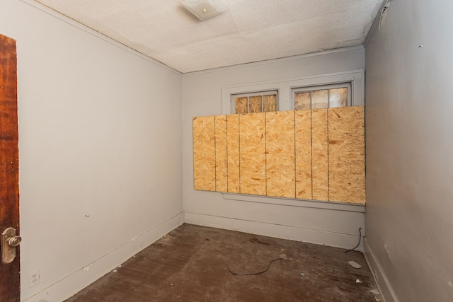 spare room featuring a textured ceiling