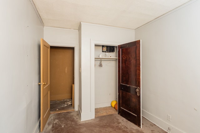 unfurnished bedroom with a closet and a textured ceiling