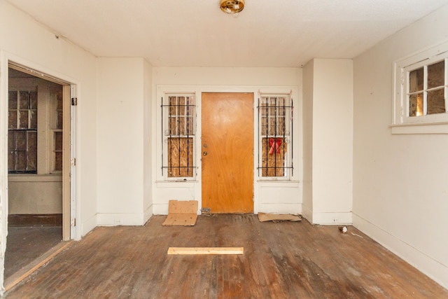 unfurnished room with dark hardwood / wood-style floors