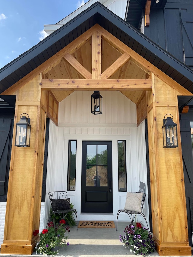 view of exterior entry with a porch