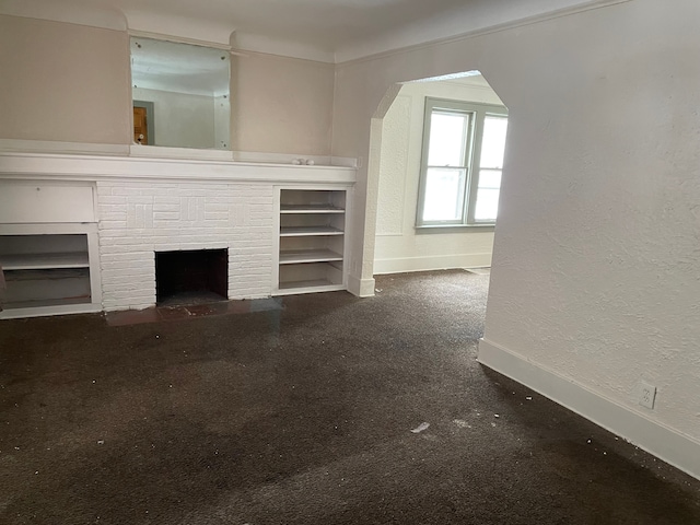 unfurnished living room with a fireplace