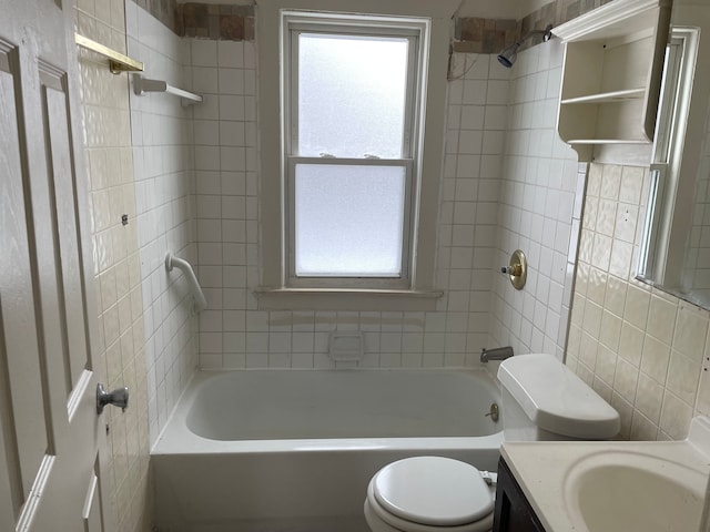 full bathroom with tasteful backsplash, toilet, vanity, tile walls, and tiled shower / bath