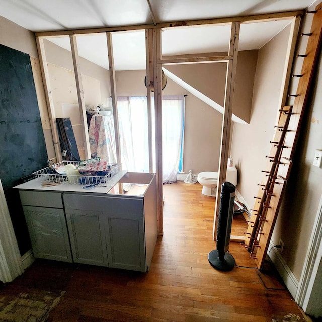 bathroom featuring toilet and hardwood / wood-style flooring