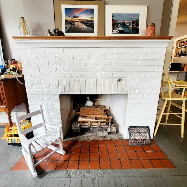 room details with hardwood / wood-style flooring and a brick fireplace