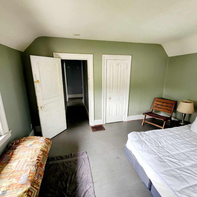 bedroom with vaulted ceiling