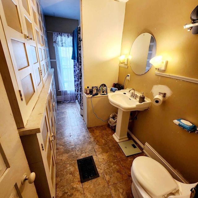 bathroom with toilet and sink