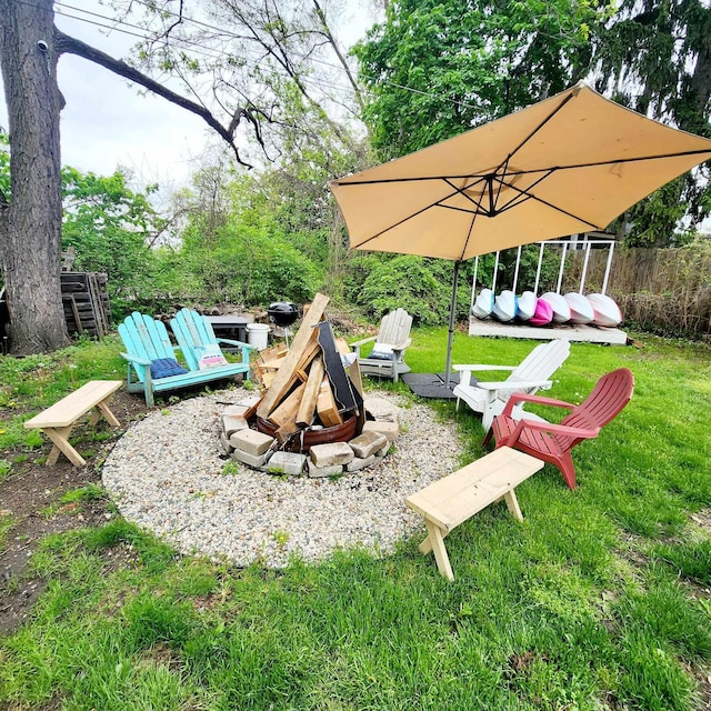 view of yard with an outdoor fire pit