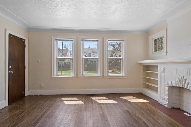 unfurnished living room featuring a textured ceiling and dark wood-type flooring