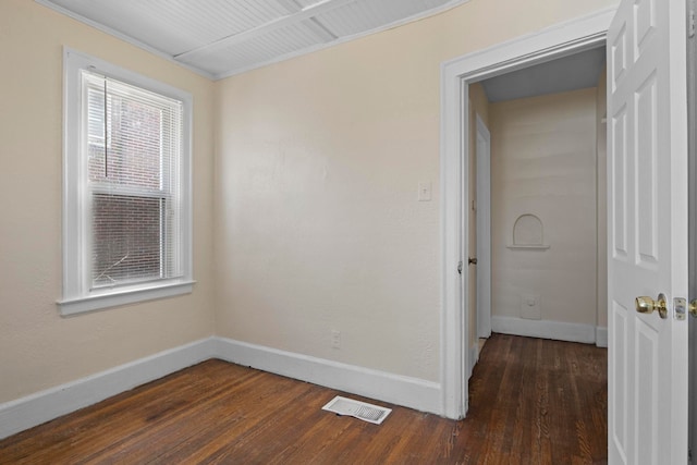 unfurnished room featuring dark hardwood / wood-style flooring