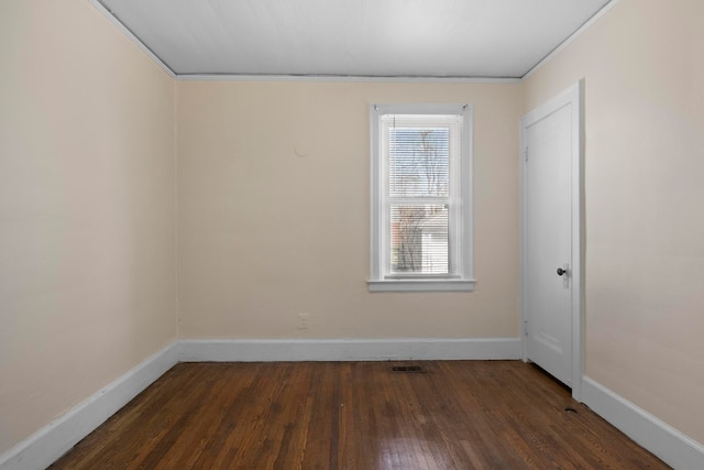 unfurnished room featuring dark wood-type flooring