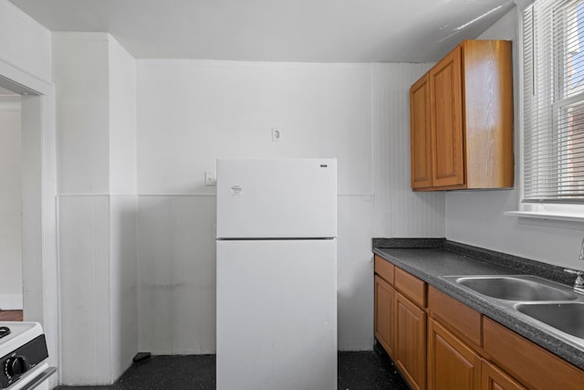 kitchen featuring sink and white refrigerator