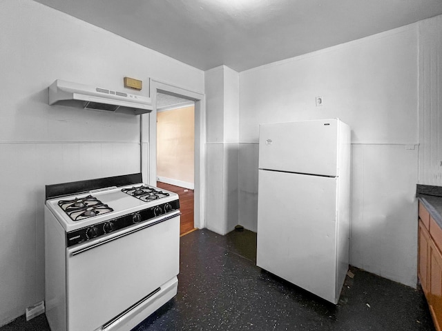 kitchen with range hood and white appliances