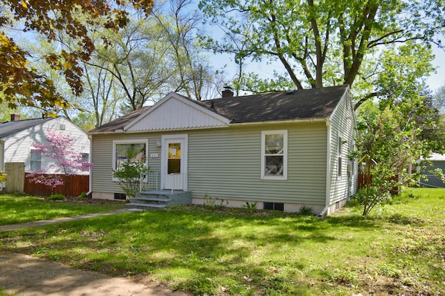 bungalow with a front yard