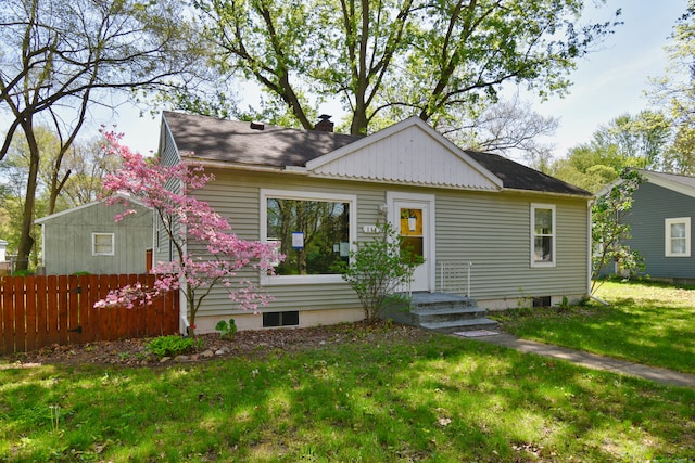 view of front of property with a front lawn