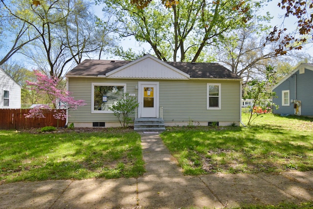 bungalow-style house with a front yard