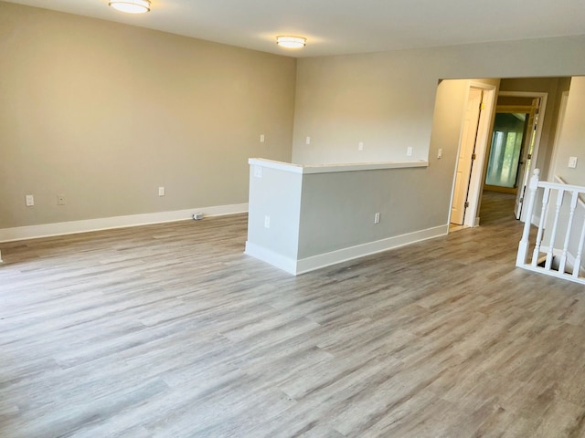 unfurnished room with light hardwood / wood-style floors