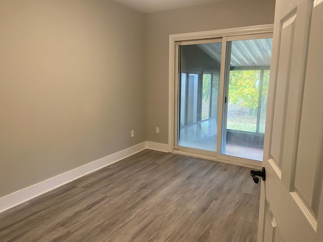 spare room featuring hardwood / wood-style flooring