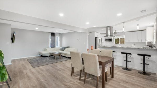 dining area with light hardwood / wood-style flooring