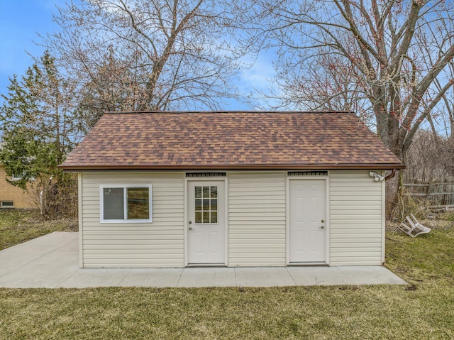 view of outdoor structure featuring a lawn