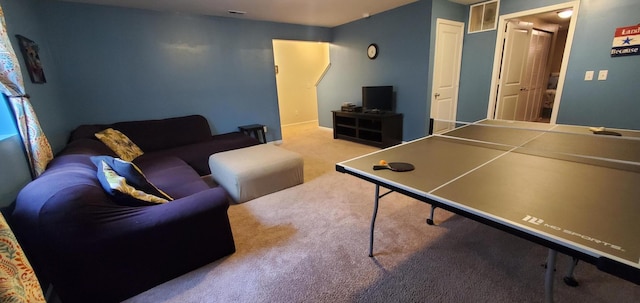 game room featuring light colored carpet