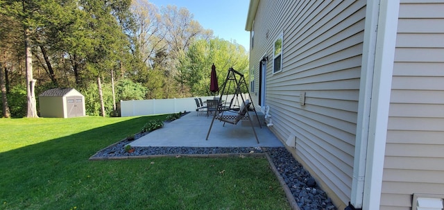 view of yard with a patio area and a shed