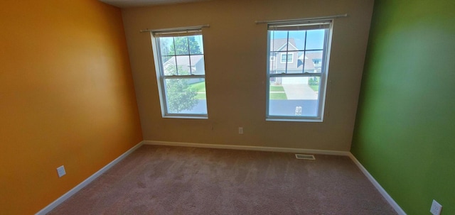 view of carpeted spare room