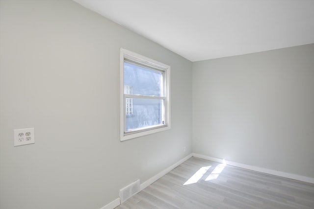 unfurnished room with light hardwood / wood-style flooring