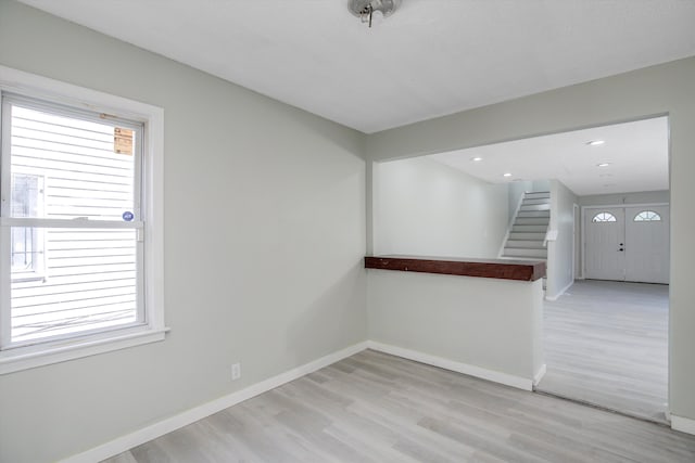 empty room with light hardwood / wood-style floors