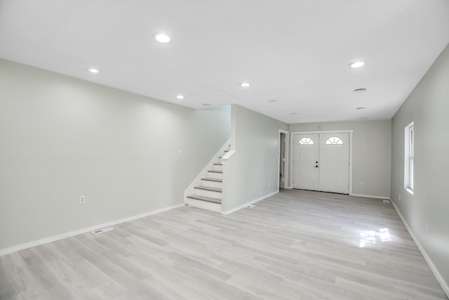 entryway with light hardwood / wood-style floors