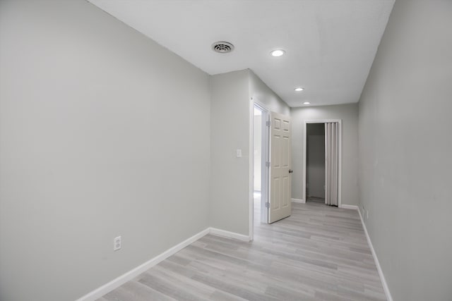 hallway with light wood-type flooring