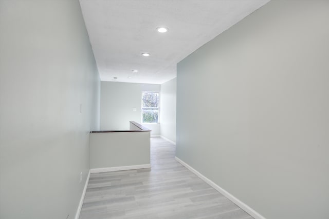 corridor featuring light hardwood / wood-style floors