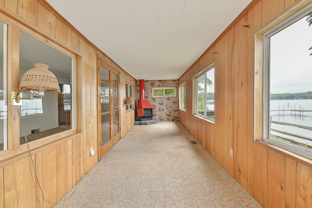 sunroom / solarium with a water view