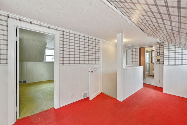 unfurnished room featuring carpet floors